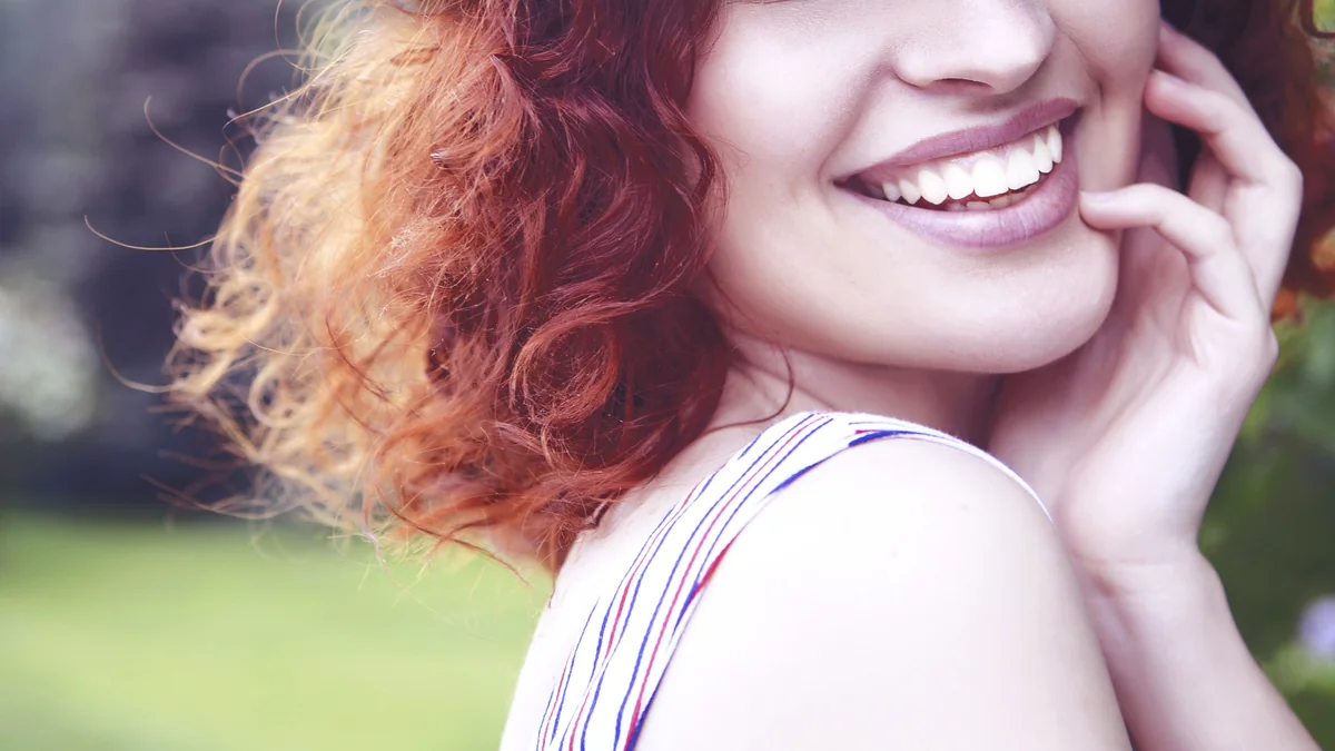 Woman smiling after composite bonding treatment at the practice in Bow