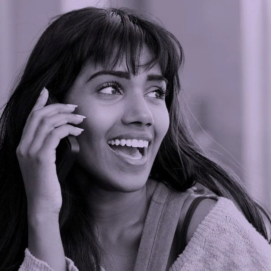 Woman with a bright smile after professional teeth whitening at the practice